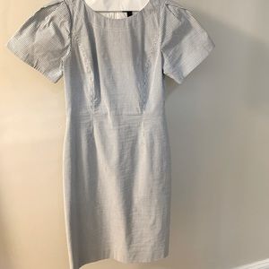 J. Crew seersucker dress with slightly puffed sleeves. Blue and white. Fitted.